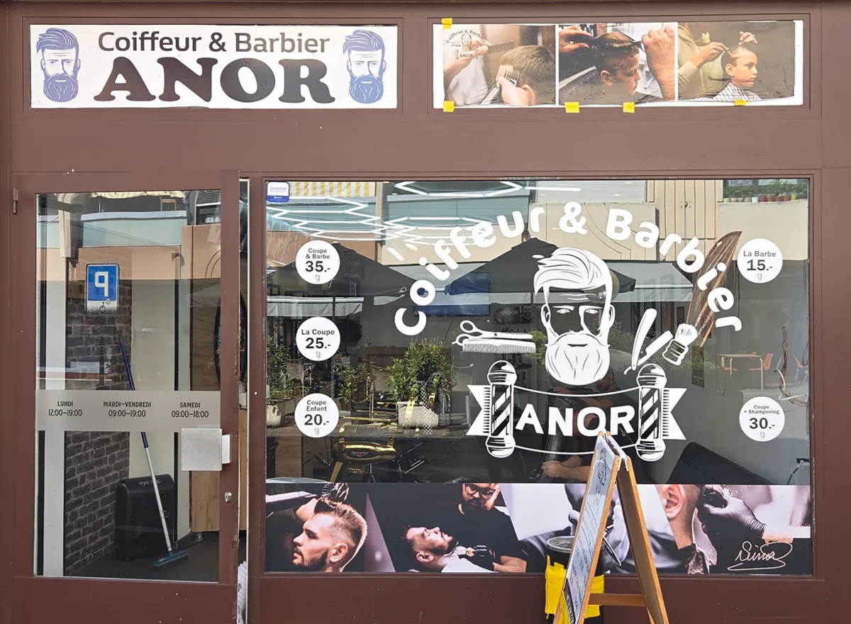 Devanture du salon Coiffeur et Barbier Anor, Promenade des Champs-Fréchets 15 à Meyrin